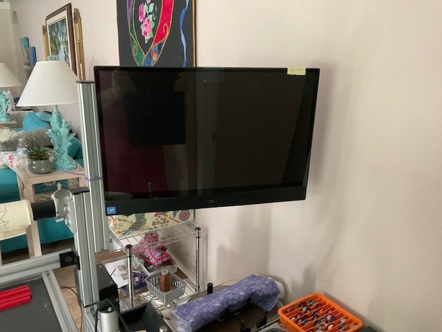 A tv mounted on a stand

Description automatically generated