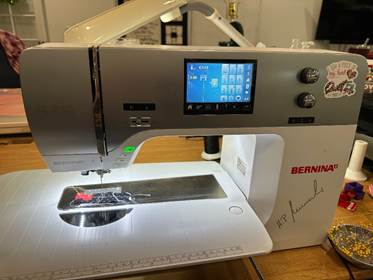 A sewing machine on a table

AI-generated content may be incorrect.